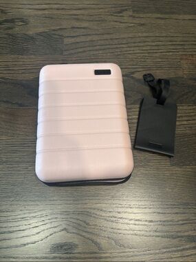 Away Mini Luggage in Pink with bag tag